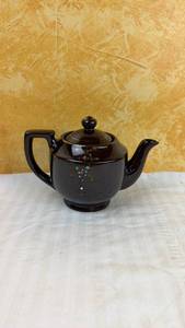 lot 136 image: Dark Brown Glazed Ceramic Teapot with Hand-Painted Floral Design