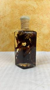 lot 157 image: Decorative Botanical Infused Glass Bottle with Stopper