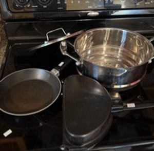 lot 173 image: Mixed Cookware Set with Frying Pan, Steamer Pot insert, and Griddle