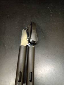 lot 1082 image: Manual Can Opener with Black Handles and Strap - Retail $0