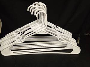 lot 1101 image: Set of 15 White Plastic Clothing Hangers - Retail $0