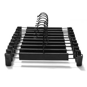 lot 58546 image: 10 Pack Clothes Pants Hangers, Space-Saving Skirt Holders with 360 ° Swivel Hooks, Adjustable Clips, Trouser Coat Garment Jeans Black - Retail $10