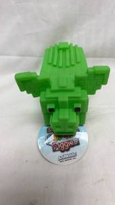 lot 33 image: AniMolds Squeeze Me Square Piggie Green Toy