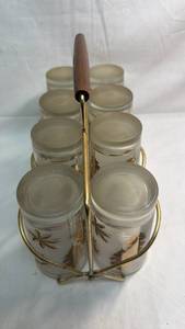 lot 65 image: 8-Piece Glass Set with Metal Carrier and Leaf Design