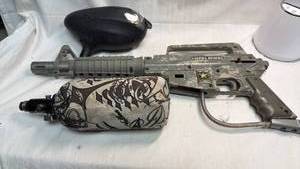 lot 116 image: Alpha Black Paintball Marker Gun with CO2 Tank and Accessories