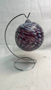 lot 149 image: Glass Ornament Sphere Burgundy White Swirl Pattern Metal Stand