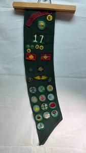 lot 247 image: Girl Scouts USA Sash with Merit Badges and Patches