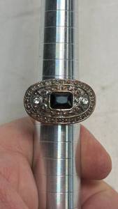 lot 275 image: Ring with Black Stone Center and Ornate Metal Band