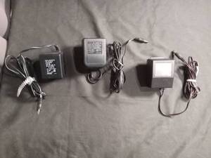 lot 6197 image: Lot of 3 AC Power Adapters - Texas Instruments AC9175A, OPX41Z410, and BML163 DC Adapters
