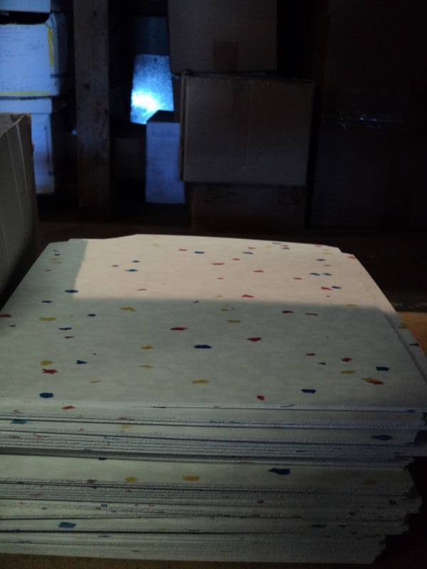 lot 3935 image: (43) ct. lot 12 x 12 tile, no box, white with red, white and blue fleck, some tiles are damaged with broken corners