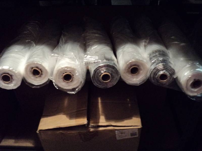 lot 3995 image: (7) rolls clear plastic bags, clear with suffocation caution message, thin plastic, used to cover small items for shipping