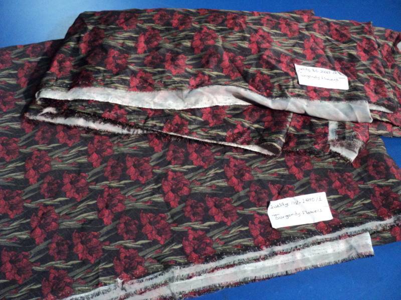 lot 4541 image: (2) pieces material (polyester) Burgundy Flowers, approx 6 yards