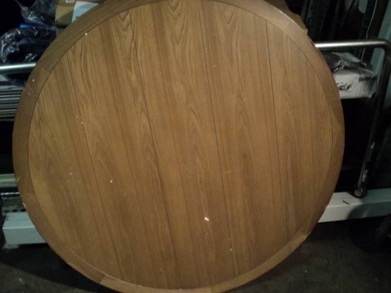 lot 4556 image: Round wooden table top 46 diameter with X style base,29-12 x 29-12, damage to top pictured, legs not included