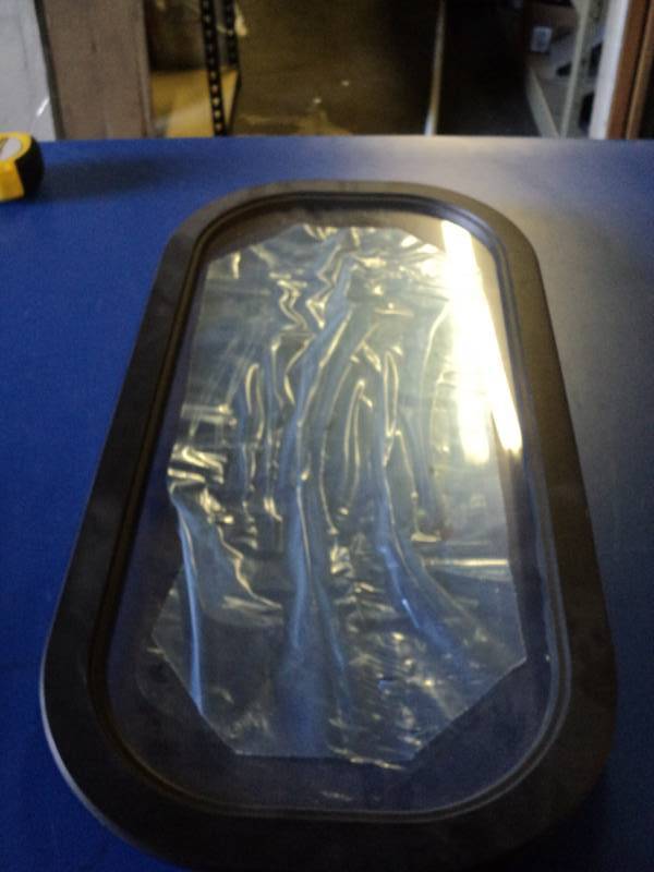 lot 4563 image: Oval (Rounded rectangle) plexi-glass window for campers or RVs, 26 x 13-12