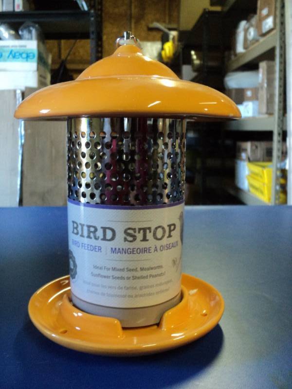 lot 4569 image: Bird Stop Orange Ceramic Bird Feeder, holds up to 1 lb mixed bird seed