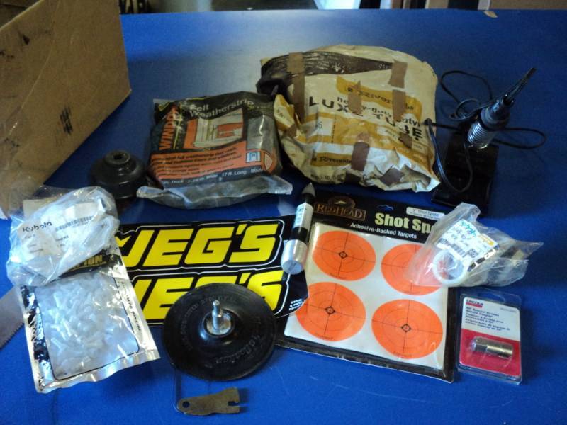 lot 4638 image: Mixed lot of misc. hardware in cardboard box weather stripping, couplers, inner tube, targets and more.