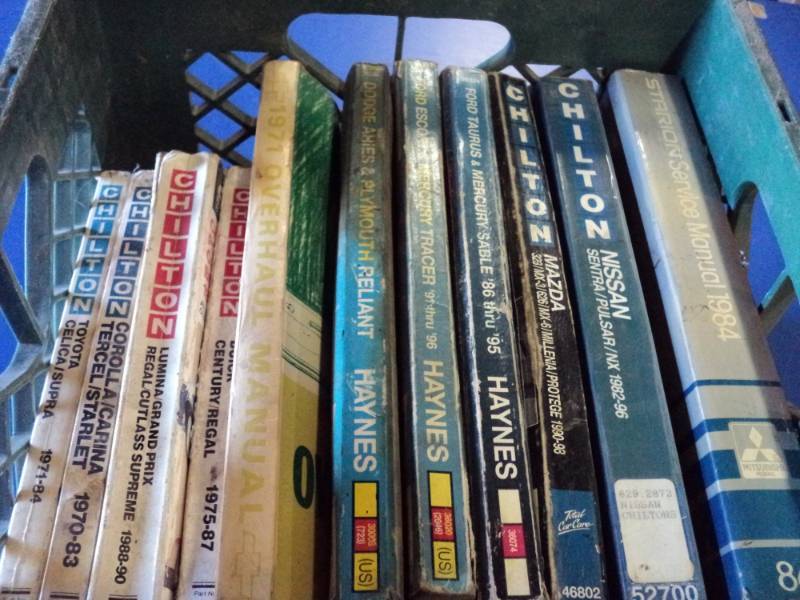 lot 4654 image: (11) ct. lot Automotive repair Manuals in a plastic crate,  Chilton, mixed years