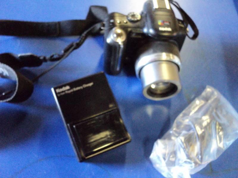 lot 4661 image: Kodak Easy Share P850 Digital Camera with Battery and charger, used, untested. Camera takes specific size re-chargeable battery, battery and charger included