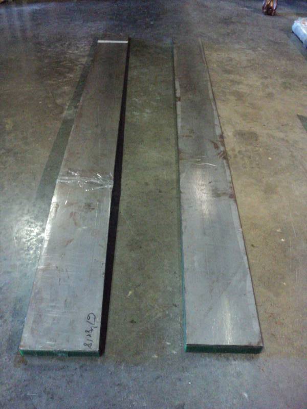 lot 4684 image: (2) pieces green neoprene with steel back, 60 x 5 x 1