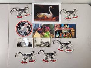lot 168 image: Mixed Paper Ephemera Lot Cat Stickers, Postcards, Arnie R. Fisk Print, Hotel Adolphus Sticker