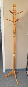 lot 25 image: Wooden Coat Rack Stand with Six Arms. 71 34 H.  Does not want to come apart for moving, so need long vehicle space