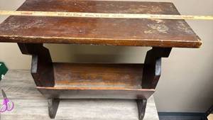 lot 34 image: Wood Accent Table with Magazine Storage - 26 W x 12 D x 25 H - finish wear and very slight bowing in top