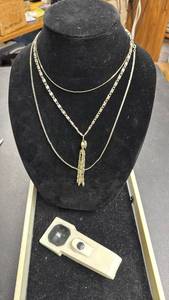 lot 103 image: Three Silver Tone Necklaces, one with Tassel Pendant and a Magnifier
