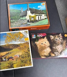 lot 150 image: Lot of 3 Puzzles 1000pc Cottage, 100pc Kittens, Landscape (no guarantees on completeness)