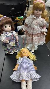 lot 153 image: Lot of 3 Dolls including one Precious Moments Doll holding a watering can