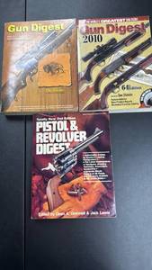 lot 215 image: Gun Digest Books 3 Volumes -1972 26th Anniversary, 2010 64th Edition, and Pistol Revolver Digest