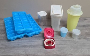 lot 413 image: Food Storage Containers Lot - Blue Ice Trays, Storage Containers, Yellow Tupperware Shaker, two small Tupperware containers with lids, and small tub of Tupperware labels