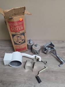 lot 423 image: Kitchen Craft Vegetable Slicer No. 2232 with Original Box and Accessories and a Wear Ever aluminum juice press