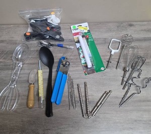 lot 428 image: Kitchen Utensils  - spoons, can  opener,  thermometer, nut crackers, hand mixer attachments and a bag of chip clips (most of them say Shep Chevrolet)
