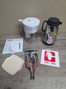 lot 432 image: Grip Kitchen Under Cabinet JarBottle Opener, Brita Pitcher, Coffee Carafe, Rivets and Spoon Rest