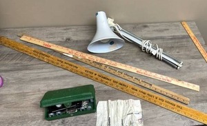 lot 307 image: Clamp Desk Light, Yard Sticks, and Vintage Singer buttonholer attachment (model # 160506) with templates, case and original manual