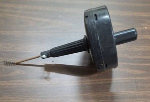 lot 922 image: Drain Cleaning Tool with Coiled Cable and Drum Head