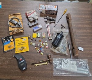 lot 941 image: Mixed Auto Parts Lot Ignition Coil, Fuses, Bulbs, Gear Puller, Tire Gauge & More