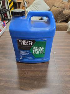 lot 969 image: Super Tech Universal Motor Oil SAE 30 2 Gallon - open container a little over half full