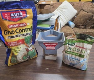 lot 1002 image: Bayer Advanced Grub Control Turf Revitalizer 14 full, Scotts Grass Seed 12 full, Kwik-Spred Spreader Lot