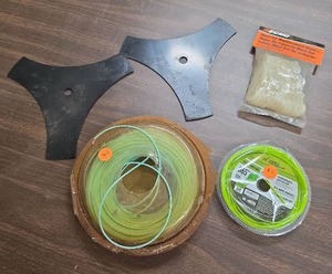 lot 1004 image: String Trimmer Replacement Blades Spools and Accessories Lot