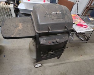 lot 1018 image: Char-Broil Gas Grill comes with propane tank,  Also included is a reusable BBQ sheet and a lighter.