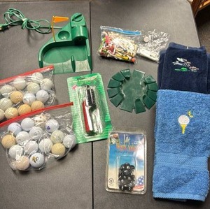 lot 750 image: Golf Accessories - Balls, Spikes, Towels, Brush, Organizer