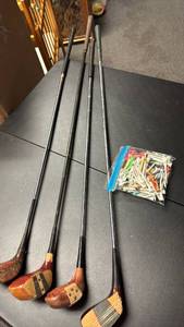 lot 756 image: 4 Vintage Wood Golf Clubs with a bag of tees