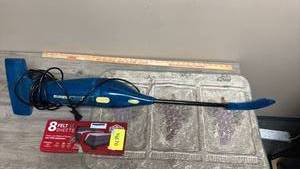 lot 576 image: Eureka Clearview Bagless Canister Vacuum Cleaner, small rug with grapes, and package of 8 furniture felt pads (new in box)