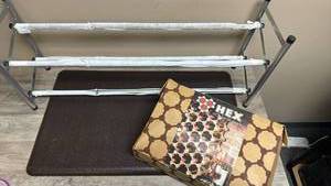 lot 577 image: Marwon Peg Board Modular Wine Rack, Adjustable Shoe Storage Rack and Brown Padded Kitchen floor mat.