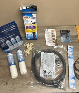 lot 579 image: Household Plumbing & Electrical Supplies Lot -  Refrigerator Filters, Toilet Repair, Light Bulbs, Water Hose and more