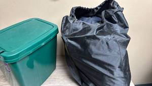 lot 588 image: Small Green Sterlite Trash Bin with Lid and Intex Air Mattress with storage Bag (appears to be either a Full or Queen Size)