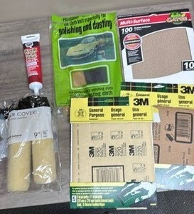 lot 589 image: Sand paper, polishing kit, paint roller covers, and kwik seal