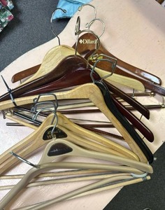 lot 603 image: Mixed Lot clothing and coat hangers - mostly wood, a few plastic