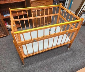 lot 28 image: Vintage Wooden Baby Crib with Colorful Spindle Beads and Mattress